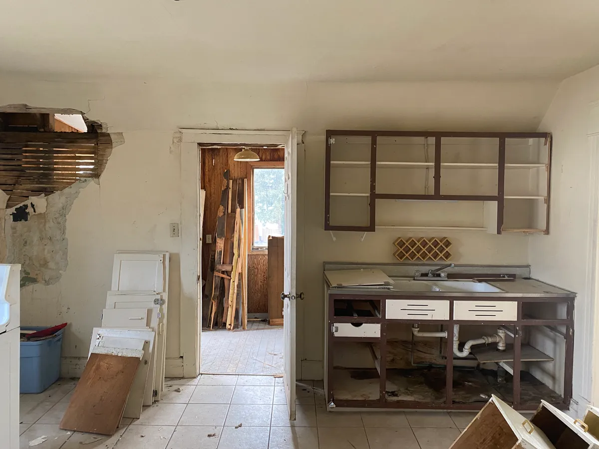 University Avenue kitchen during renovation with walls open and cabinetry removed